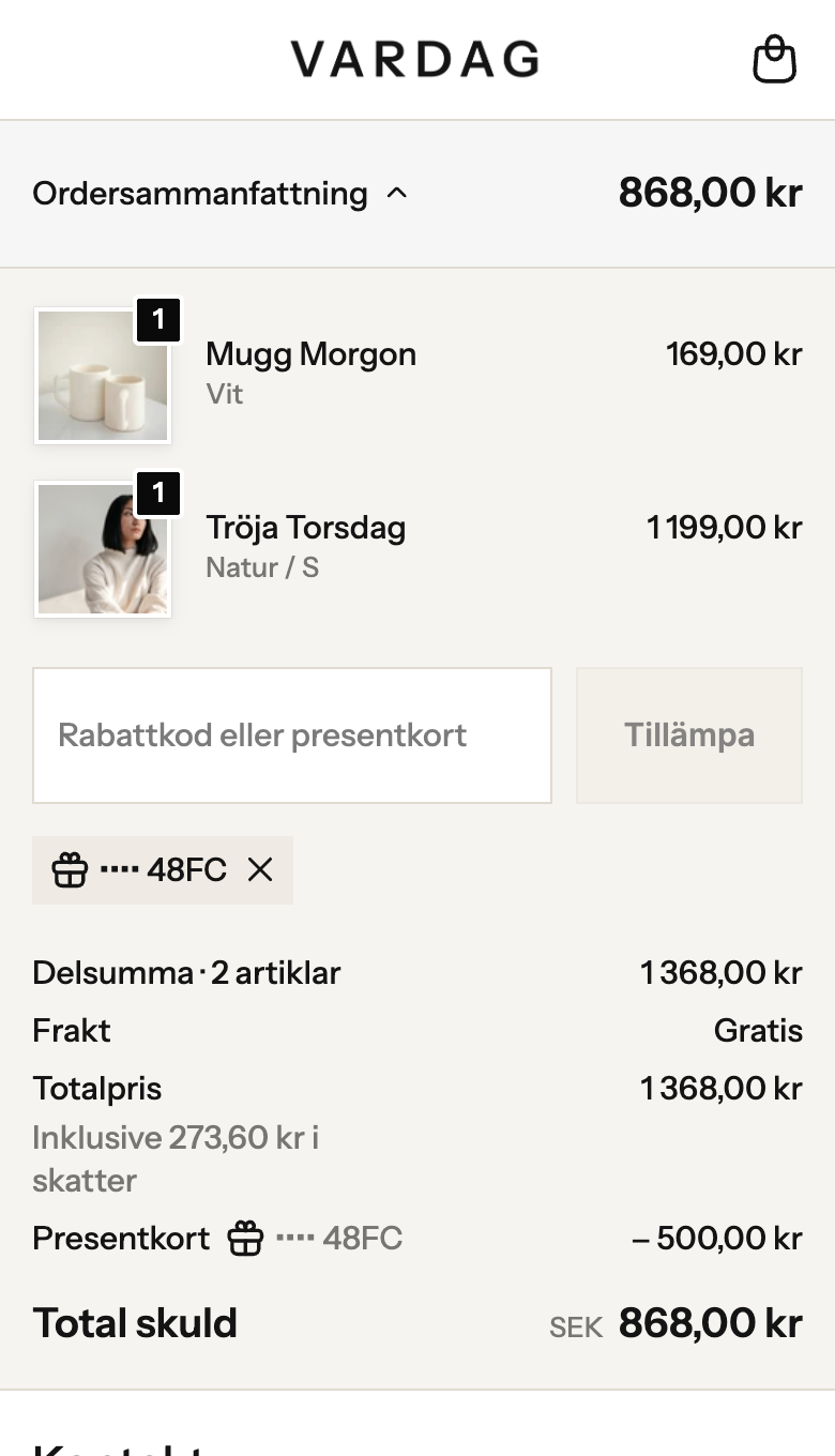 Kassan i Vardag-butiken på mobil: ordersammanfattningen med Mugg Morgon och Tröja Torsdag, presentkortet 48FC draget, −500,00 kr, Total skuld 868,00 kr